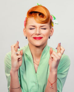 Closeup red head young woman pretty pinup girl green button shirt giving thumbs up sign gesture looking at you camera isolated white background retro vintage 50's style. Human emotions body language