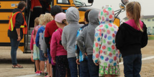 Children in line to board the school bus